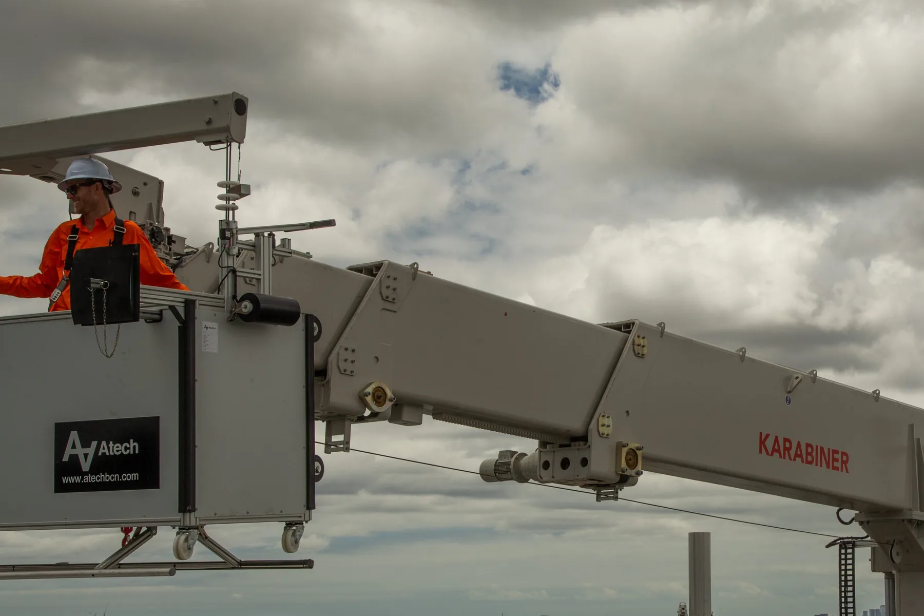 Karabiner BMU cradle and jib arm on a rooftop, with the operator in the cradle